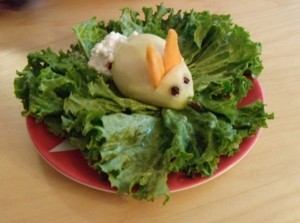 Almost the entire month of March I make Mini Maven all kinds of Easter-y meals. Here's a fine example: a peeled pear on a bed of "grass" with clove eyes, carrot ears, and a cottage cheese "cottontail". She "eats it up"!