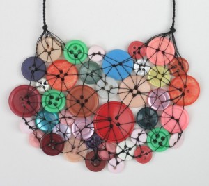 Button necklaces! All those buttons you cut off the sleeves, throw into a stockpile somewhere, and then forget about when a button actually DOES fall off... Put them to use! This would be more fun than needlepoint. If I did needlepoint, it would end up out the second story window. #crosseyed 