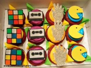 I found these totally tubular '80s-themed retro cupcakes on 2 time winners & Food Network champions, Rebecca & Christy's, blog for Suite 106 Cupcakery. These would NOT gag me with a spoon! 